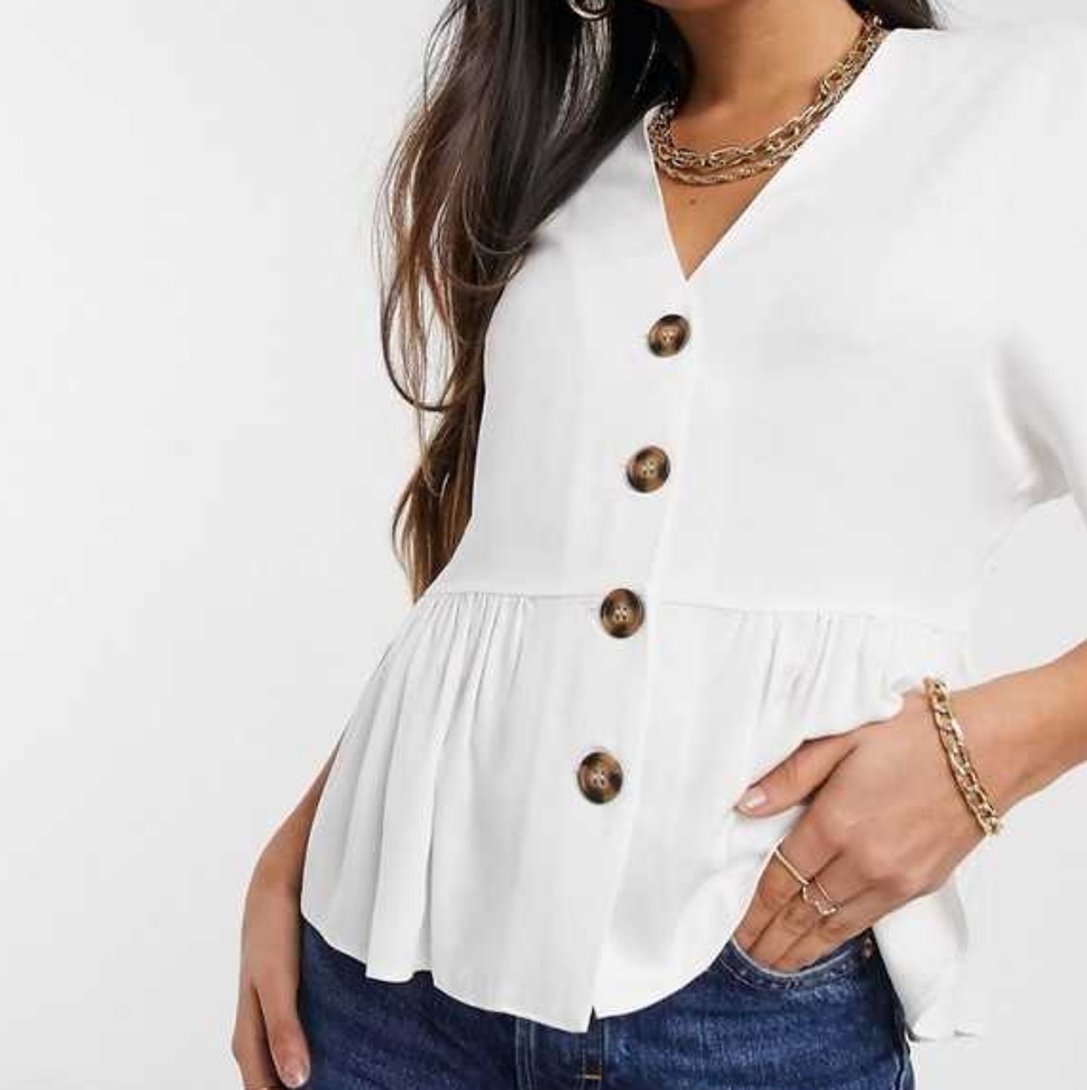 ASOS DESIGN peplum top with contrast buttons in ivory